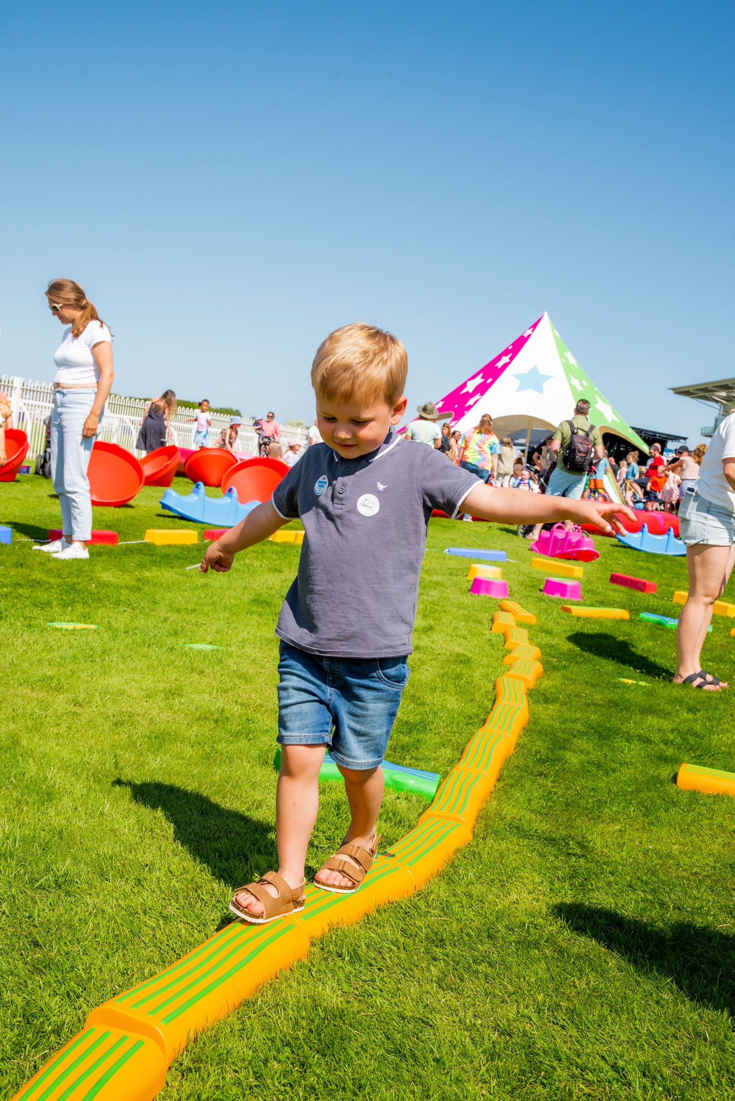 Child using balance and movement during outdoor sensory play activity