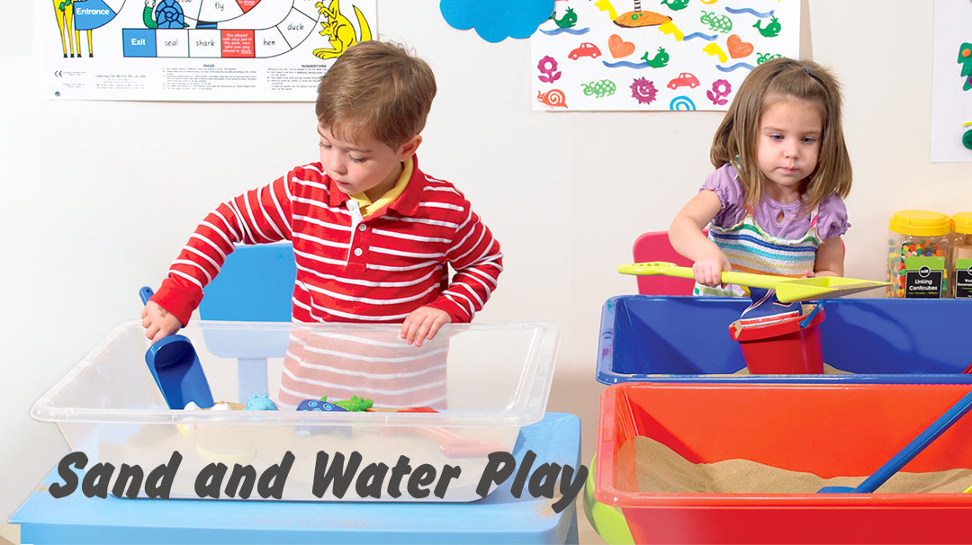 Two young children engaged in sensory play using an Edx Education sand and water play table.